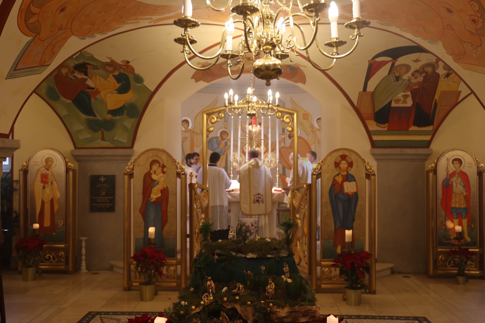 Christmas liturgy in the Byzantine chapel with the crib in the foreground