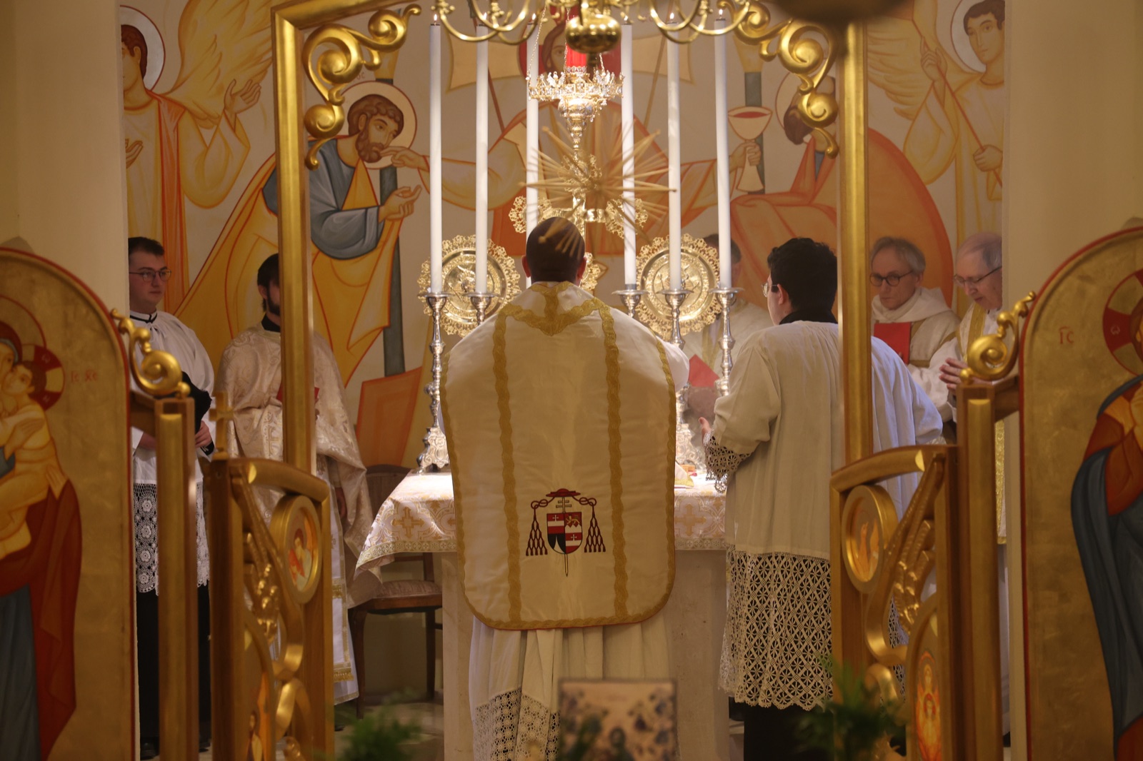 Divine Liturgy in the Byzantine chapel, the celebrant in gold vestments at the altar